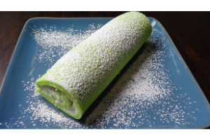 Pandan Mango Roll Cake: Sift Powder Sugar