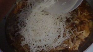 Adding Bihon noodles